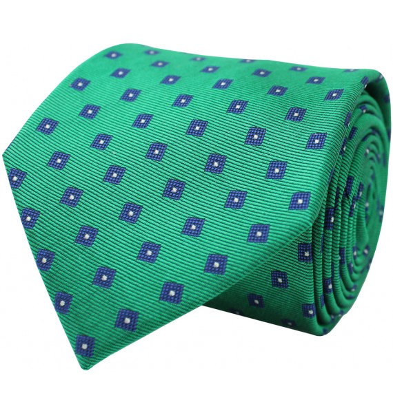 Green tie with printed geometric figures in blue. 100% Silk.