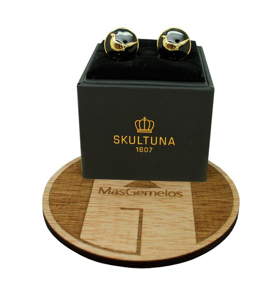 The Pheasant Skultuna Cufflinks in black background - golden