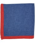 Pañuelo de bolsillo azul marino y esquinas en rojo fabricado en lino